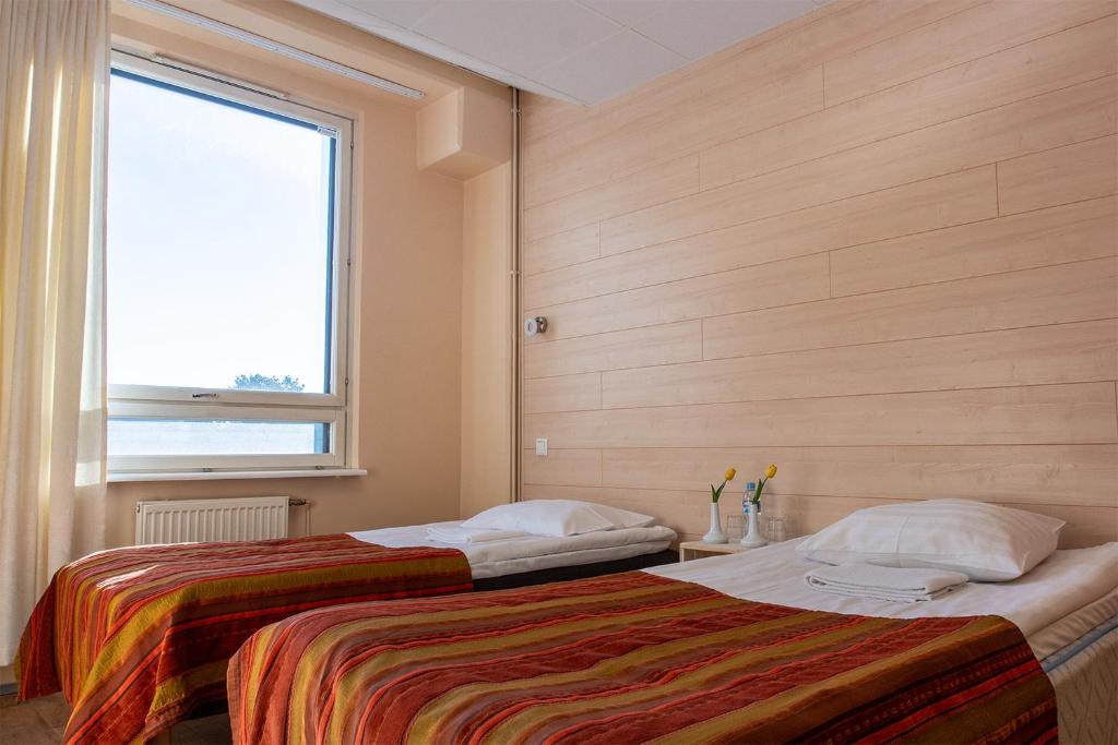 Voodi või voodid majutusasutuse Center Hotel toas