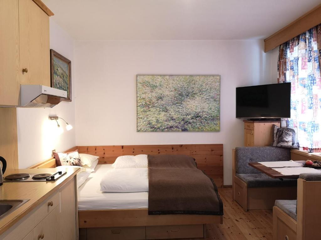 Postel nebo postele na pokoji v ubytování Molignon - Ortisei - Val Gardena