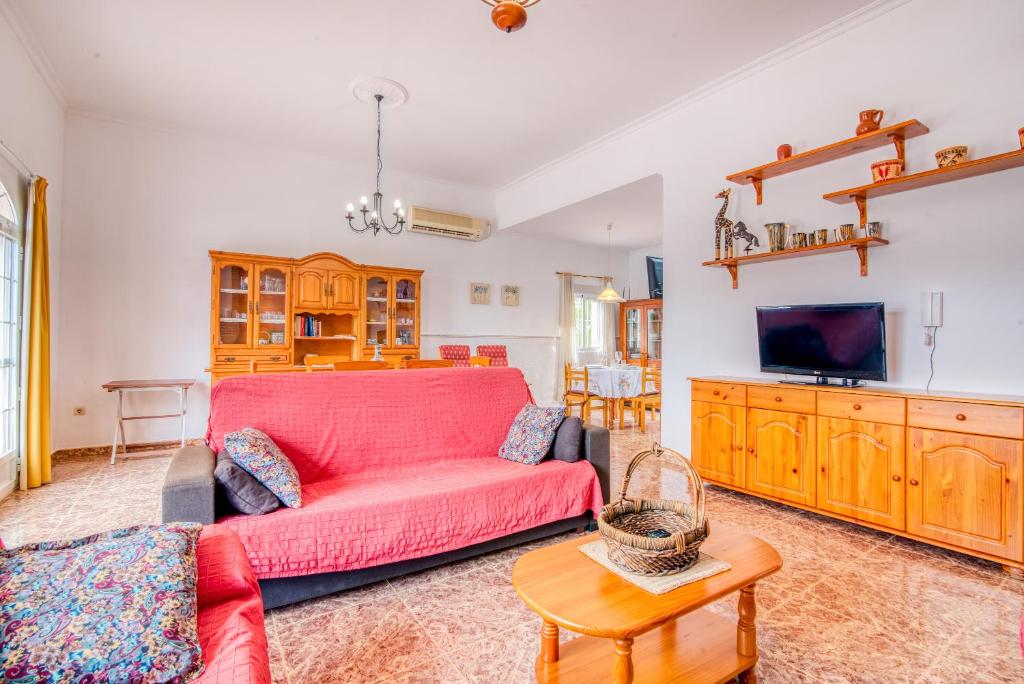 A television and/or entertainment centre at Chalet Villa Bonavista
