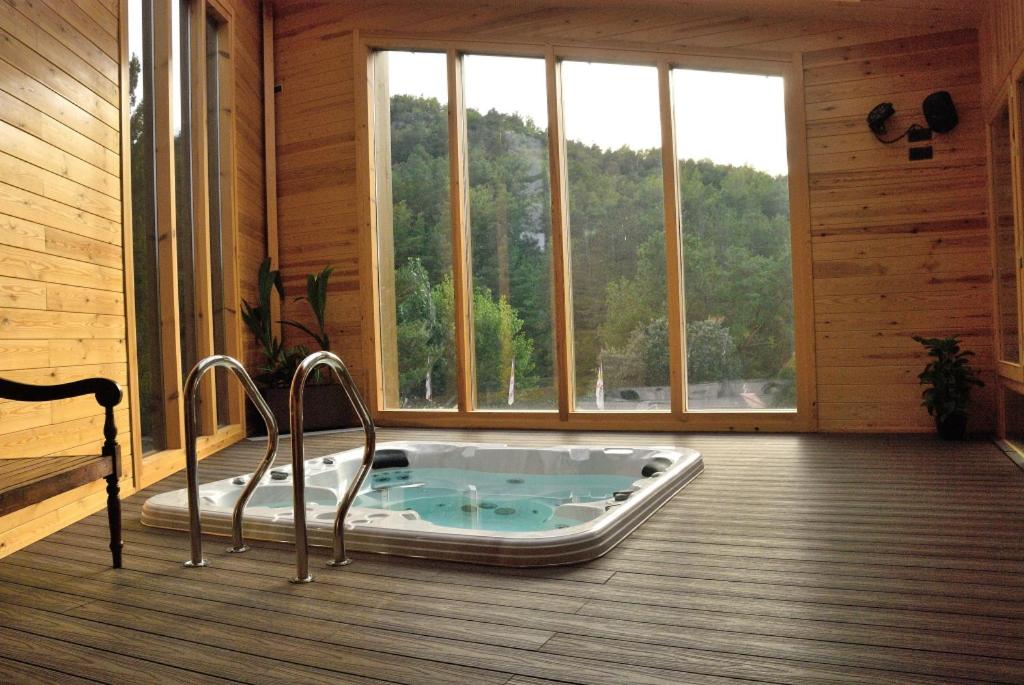 a jacuzzi tub in the middle of a room at Camping Prades Park in Prades