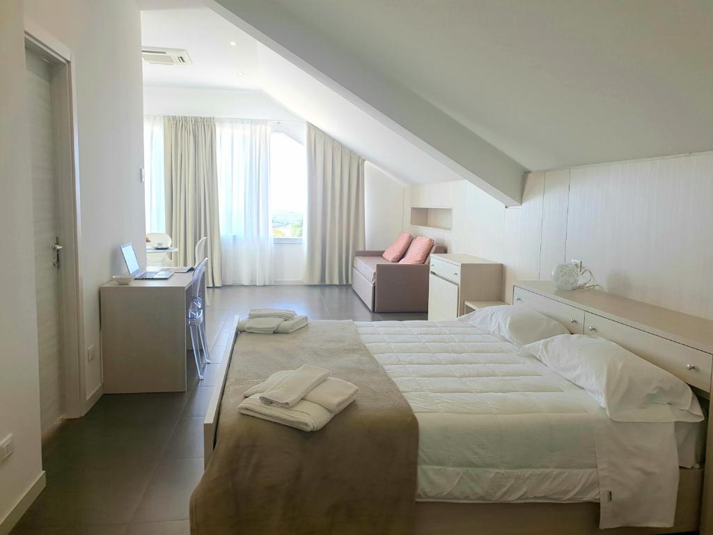 Postel nebo postele na pokoji v ubytování Hotel Grel