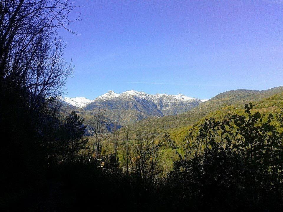a view of a mountain range with snow covered mountains at Marisa Mored vivienda de uso Turistico in Laspaúles