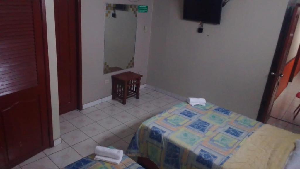 Postel nebo postele na pokoji v ubytování Hotel Queens