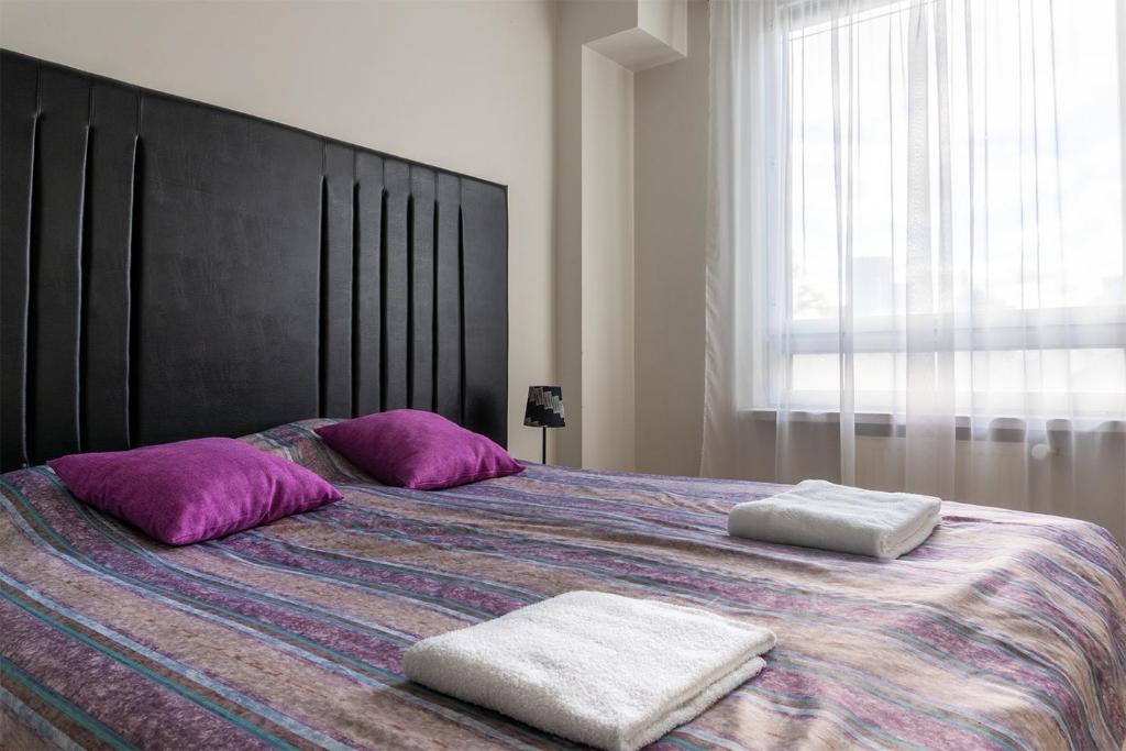 Voodi või voodid majutusasutuse Center Hotel toas