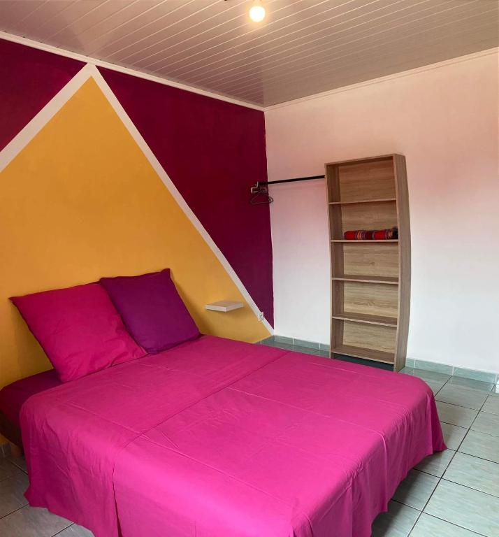 Postel nebo postele na pokoji v ubytování Le petit cactus 2