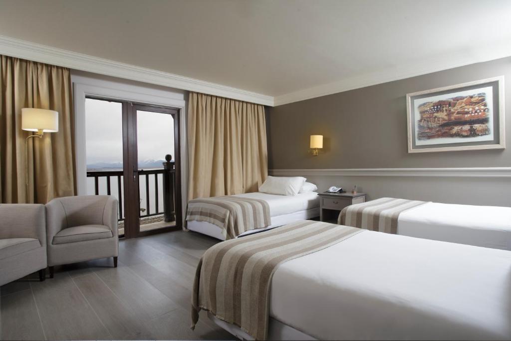 Postel nebo postele na pokoji v ubytování Hotel Costaustralis