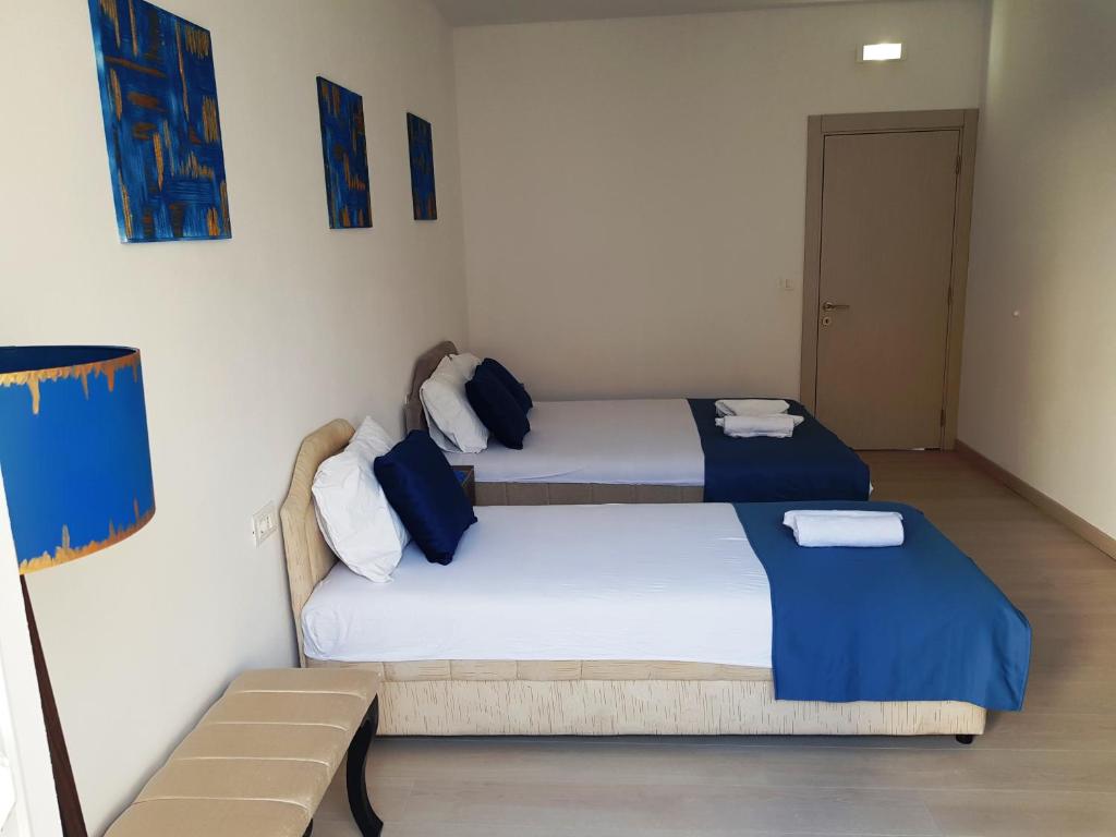 Postel nebo postele na pokoji v ubytování Villa Alba Apartments