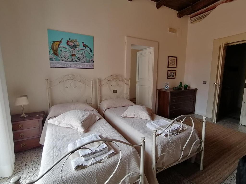 Postel nebo postele na pokoji v ubytování B&B Palazzo Lanza