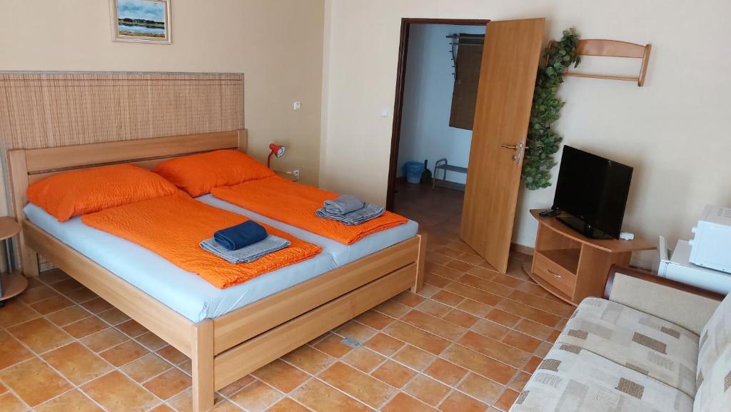 Postel nebo postele na pokoji v ubytování Rožmberská bašta