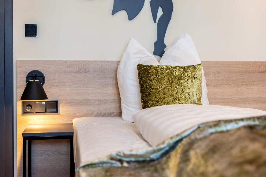 Postel nebo postele na pokoji v ubytování Hotel zur Börse