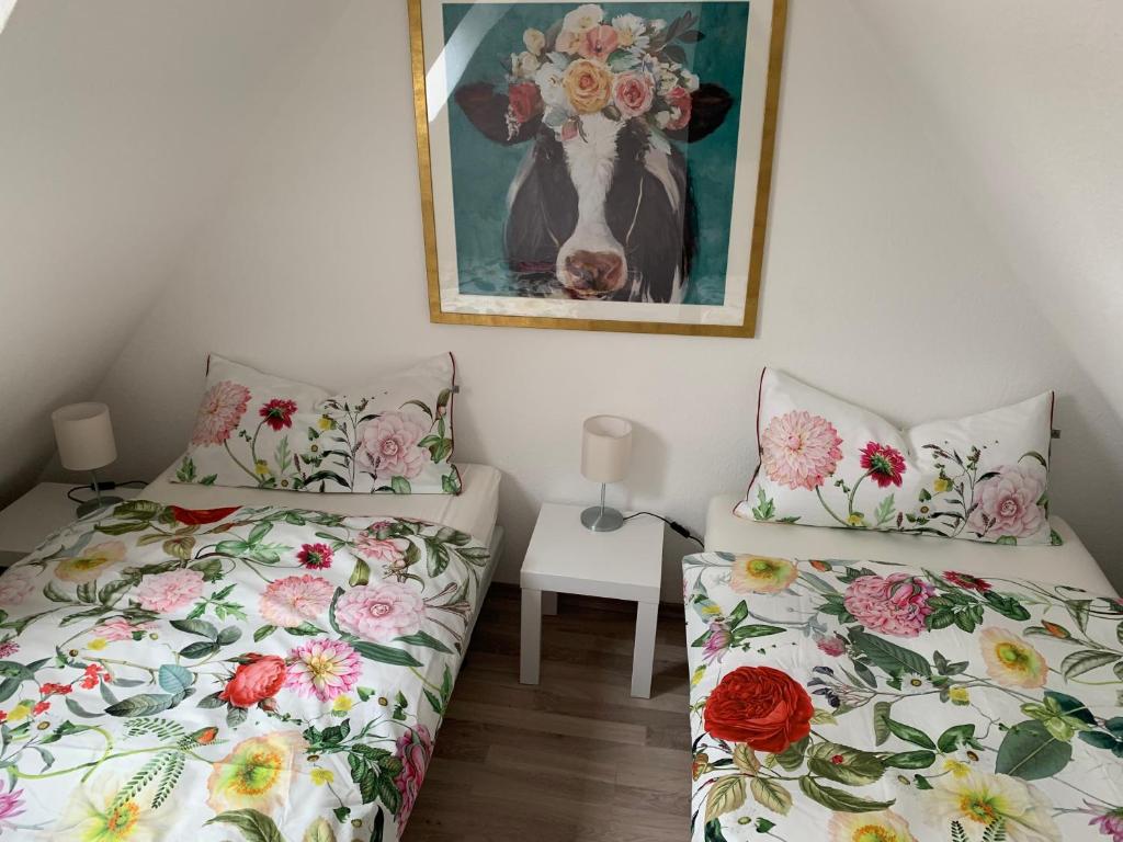 Postel nebo postele na pokoji v ubytování Ferienwohnung Lüttje Hörn