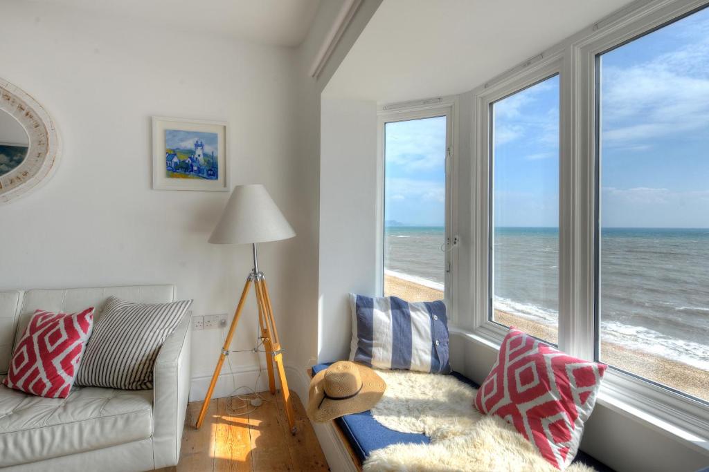 a living room with a view of the ocean at Starfish in Lyme Regis