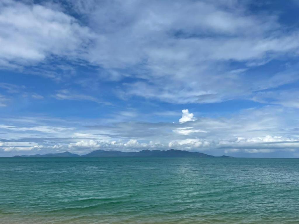 a view of the ocean under a cloudy sky at В Гостях на Иссык-Куле in Cholpon-Ata