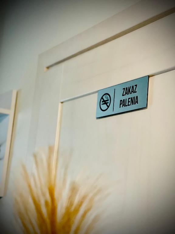 Certifikát, ocenenie alebo iný dokument vystavený v ubytovaní Apartament z jacuzzi - Centrum Szczytna Mazury