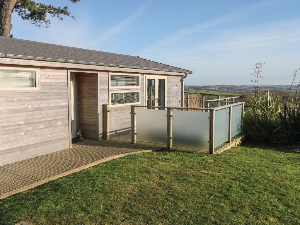 a home with a deck and a house at 12 Faraway Fields in Liskeard