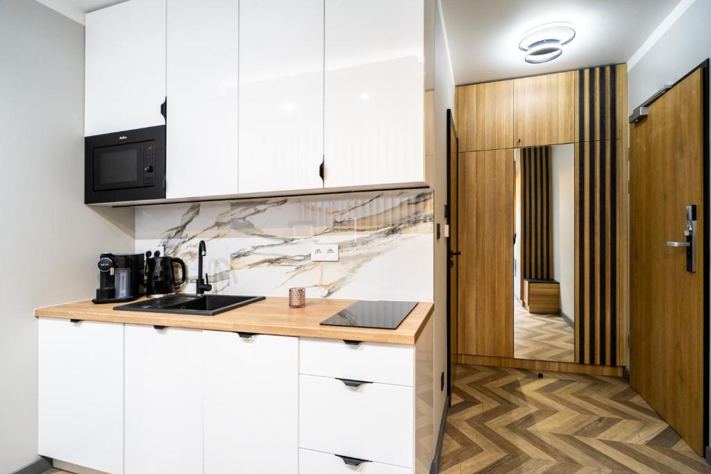 Kuchyňa alebo kuchynka v ubytovaní Apartament Adasiowa Polana by Apart Concept Podhale