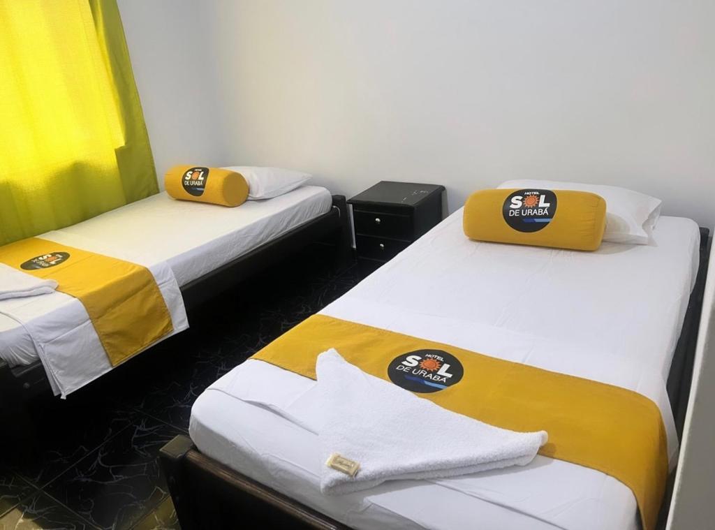 Postel nebo postele na pokoji v ubytování Hotel sol de uraba