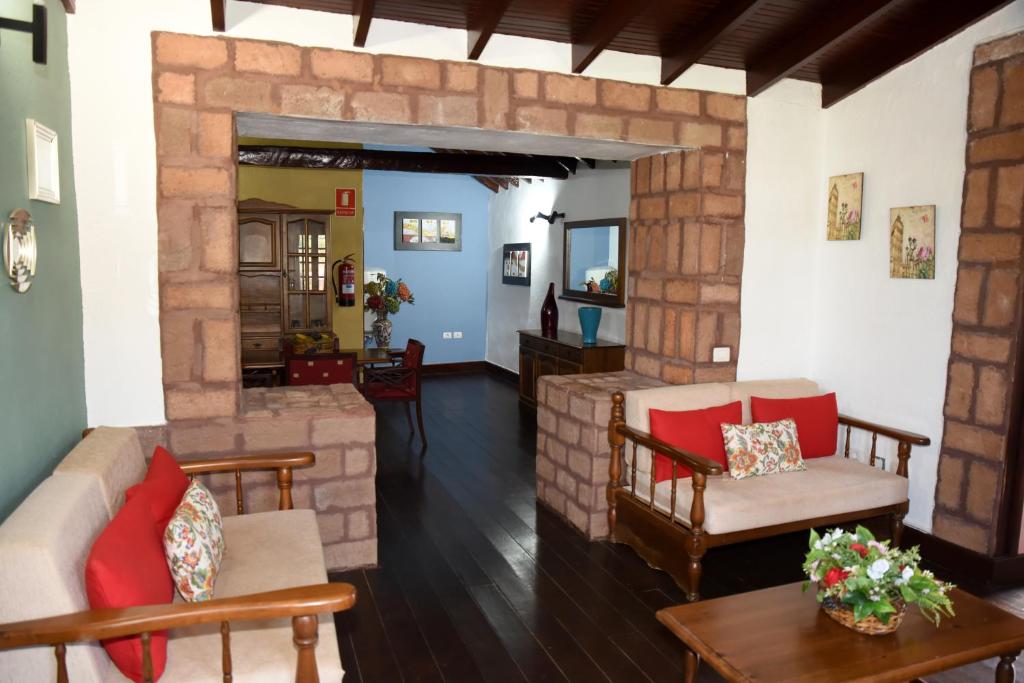 Coin salon dans l'établissement Hotel Rural Finca La Hacienda