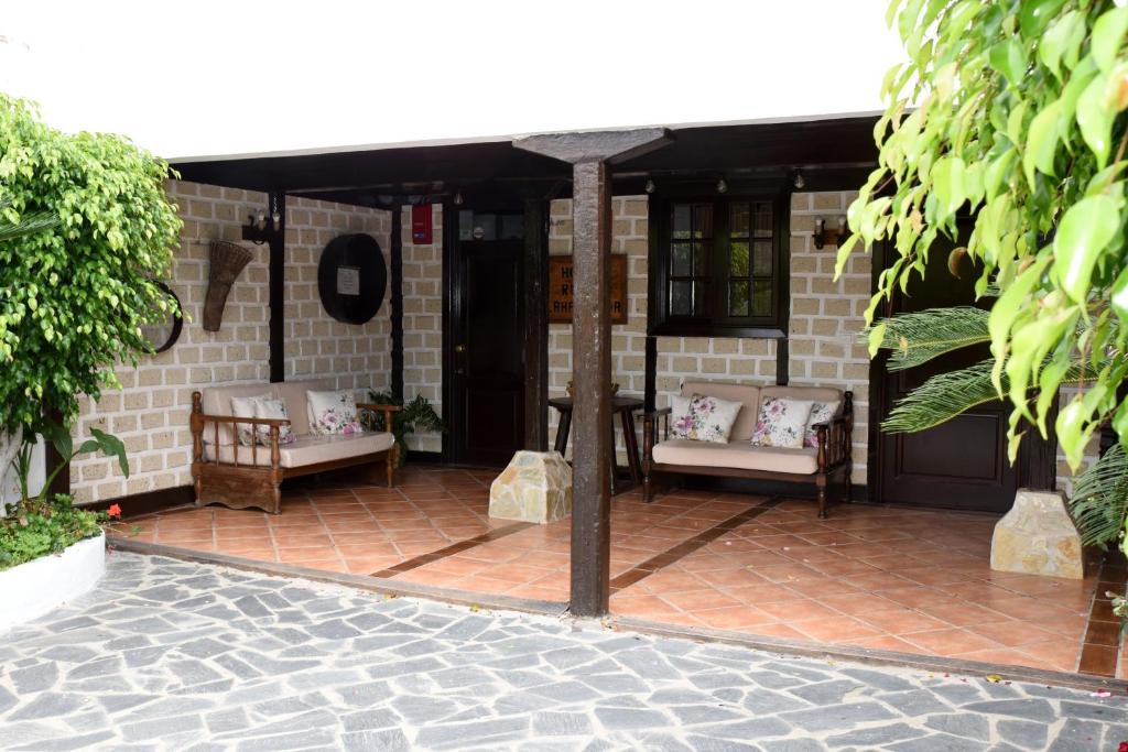 Coin salon dans l'établissement Hotel Rural Finca La Hacienda