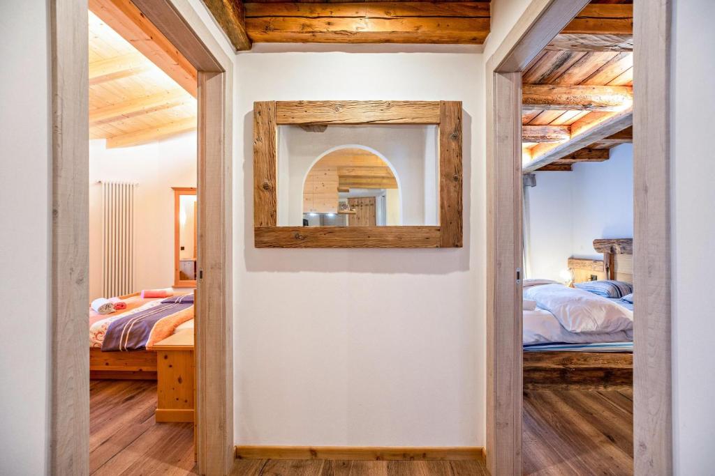 Posteľ alebo postele v izbe v ubytovaní Chalet Osmar Appartamento 2