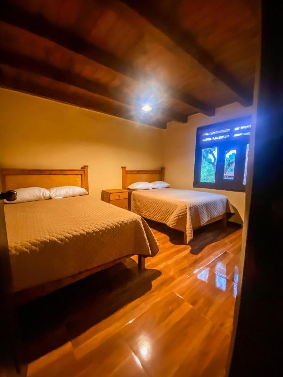 Postel nebo postele na pokoji v ubytování Cabaña La Esperanza