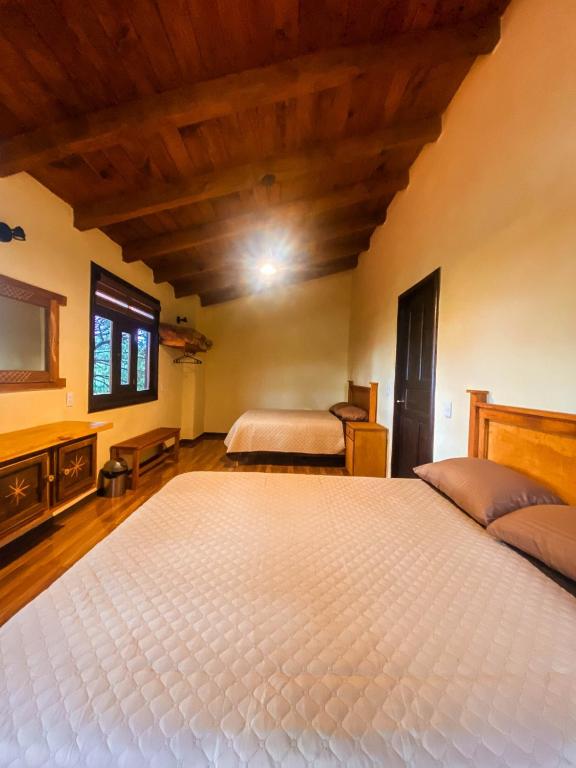 Postel nebo postele na pokoji v ubytování Cabaña La Esperanza