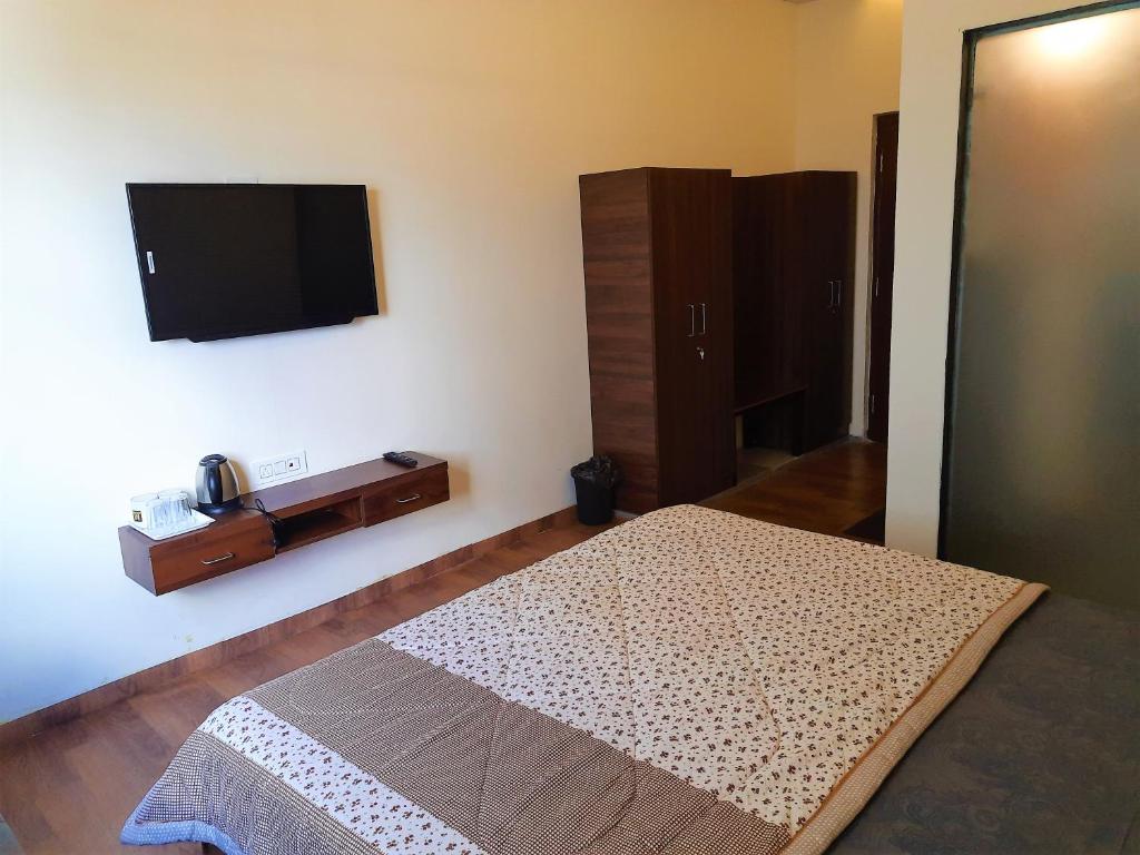 Postel nebo postele na pokoji v ubytování Stovehouse Inn