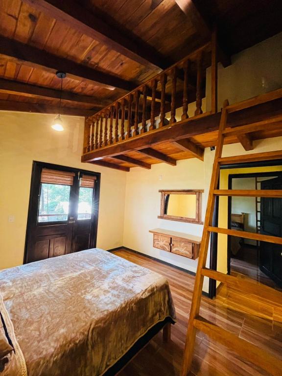 Postel nebo postele na pokoji v ubytování Cabaña La Esperanza
