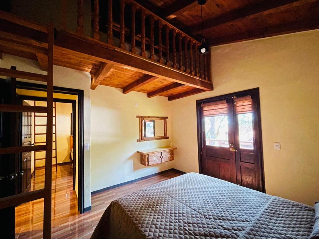 Postel nebo postele na pokoji v ubytování Cabaña La Esperanza