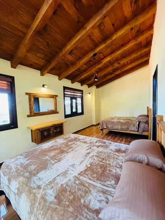 Postel nebo postele na pokoji v ubytování Cabaña La Esperanza