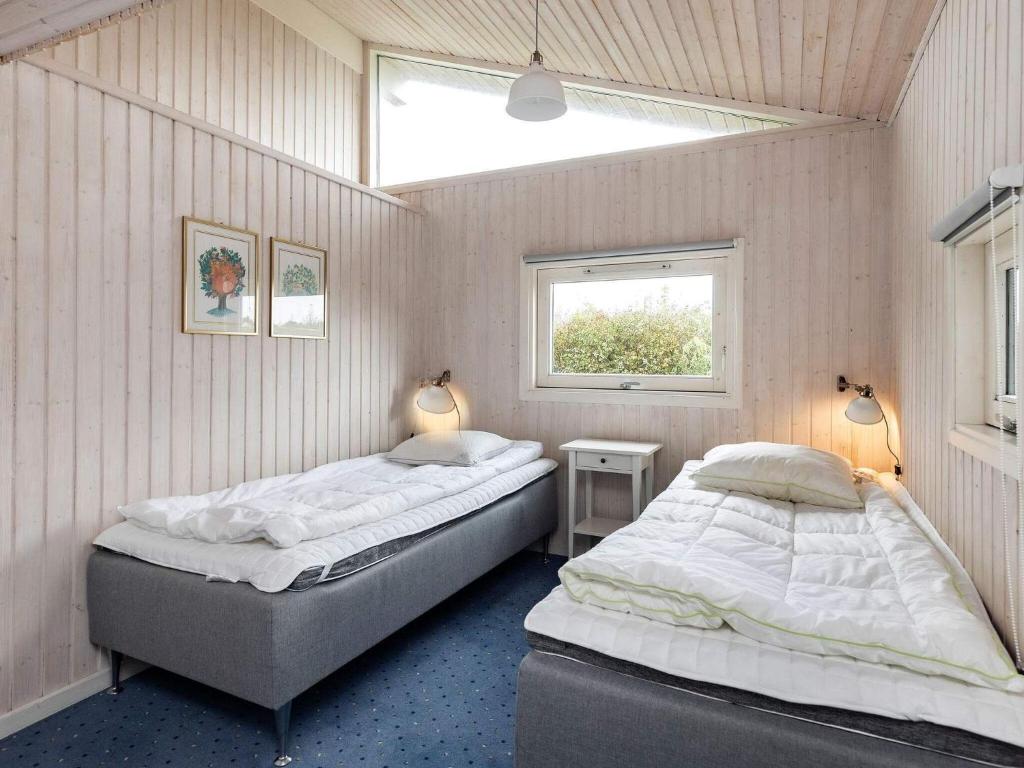 Postel nebo postele na pokoji v ubytování Holiday home Otterup XVIII
