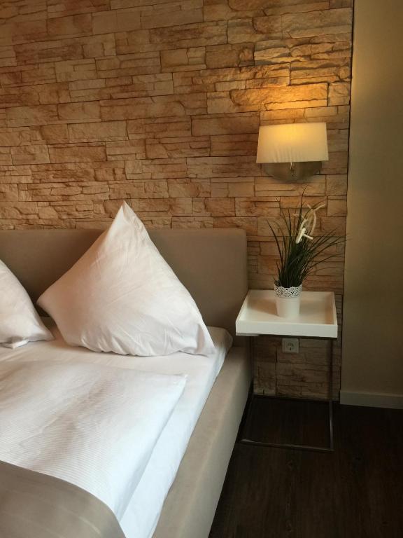 Postel nebo postele na pokoji v ubytování Hotel Achilles