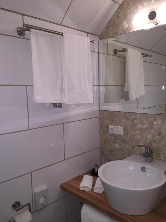 Koupelna v ubytování Hotel Achilles