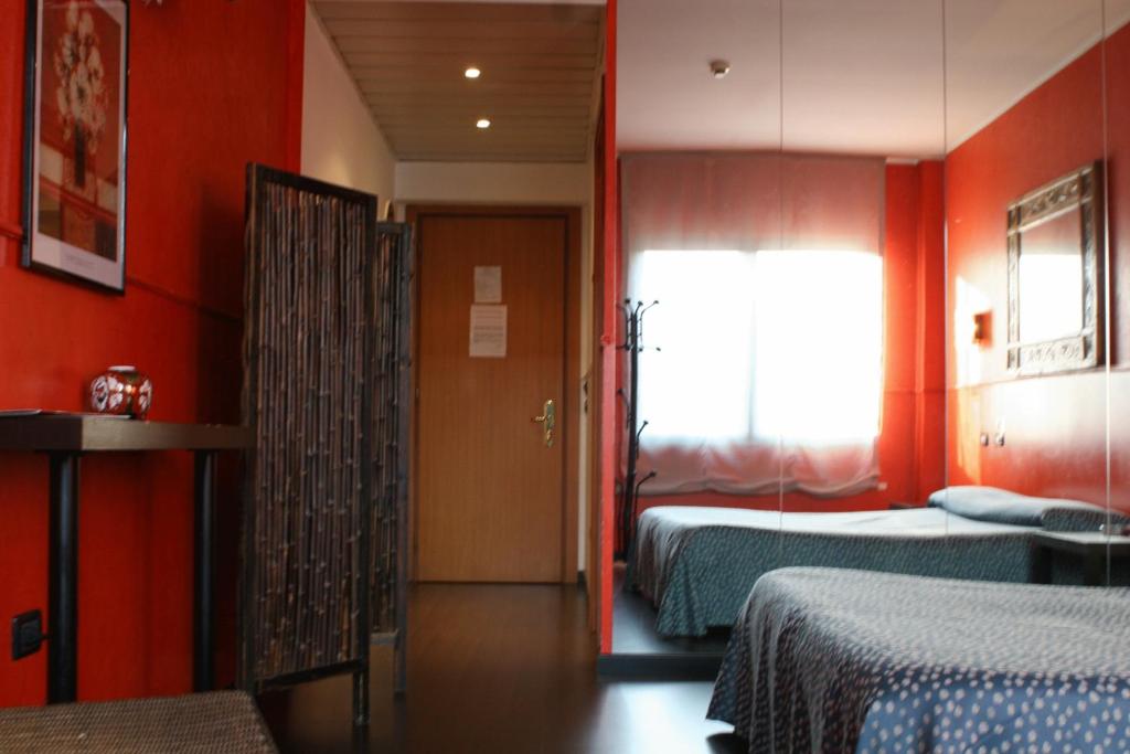 Postel nebo postele na pokoji v ubytování Orzihotel