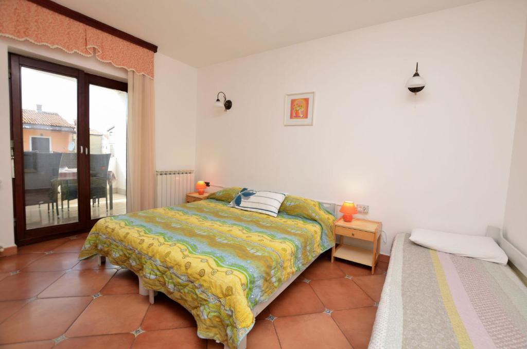 Łóżko lub łóżka w pokoju w obiekcie Apartment Reno