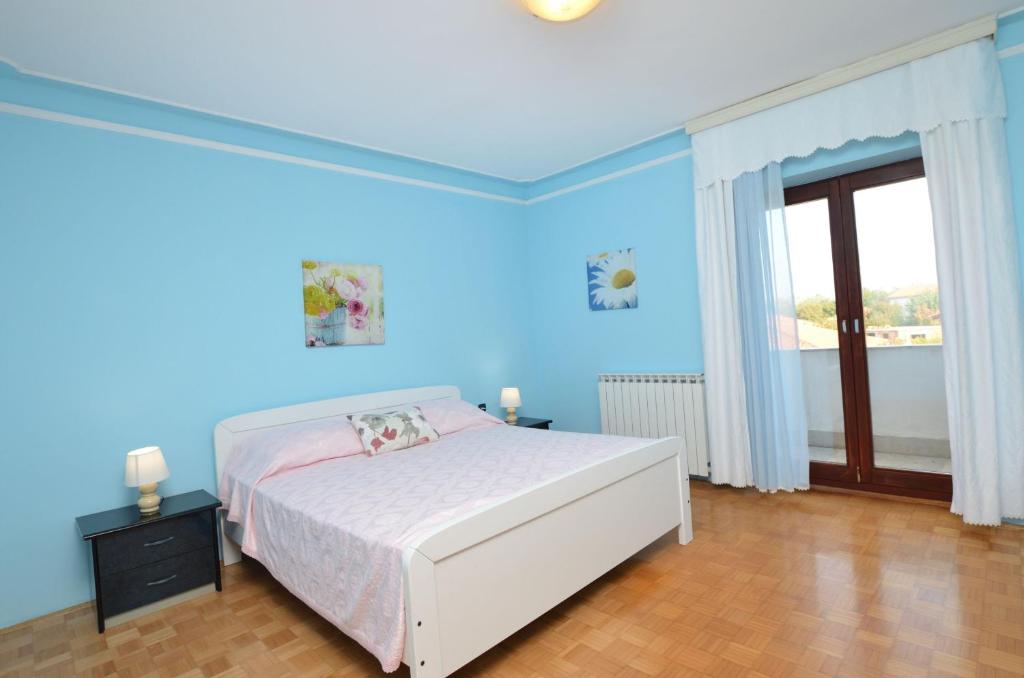 Łóżko lub łóżka w pokoju w obiekcie Apartment Reno