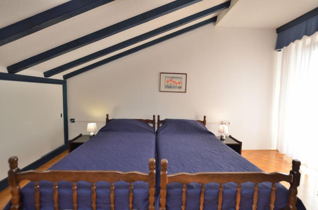 Łóżko lub łóżka w pokoju w obiekcie Apartment Reno