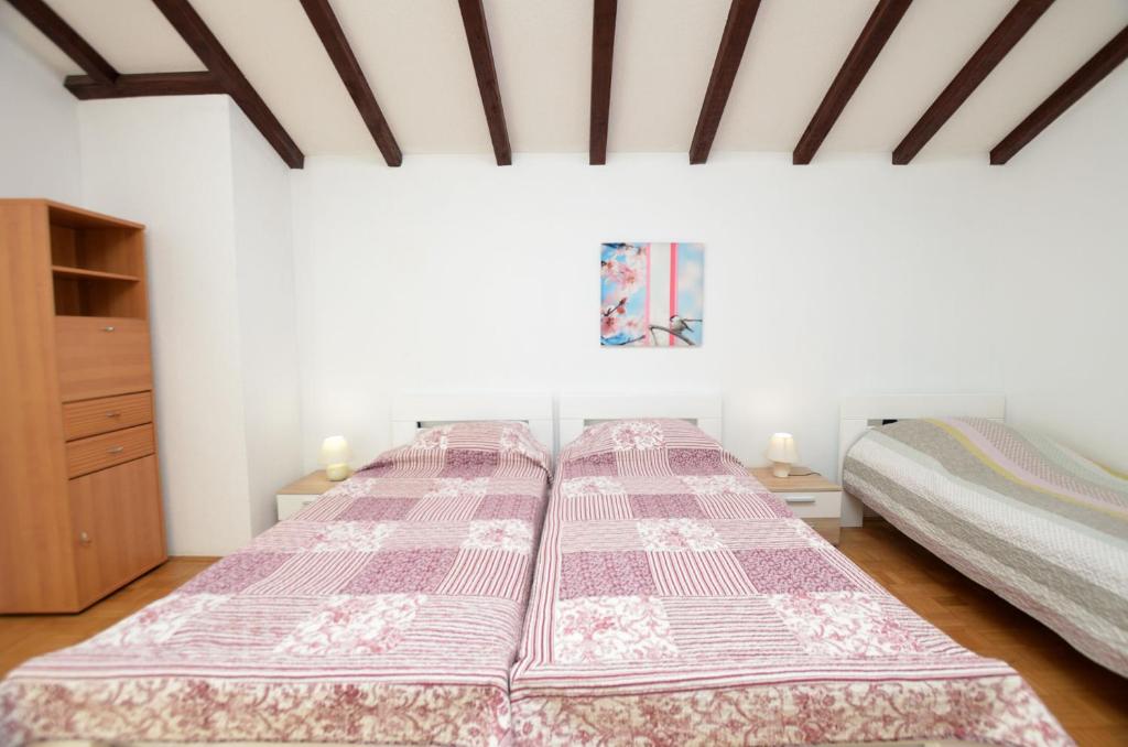 Łóżko lub łóżka w pokoju w obiekcie Apartment Reno