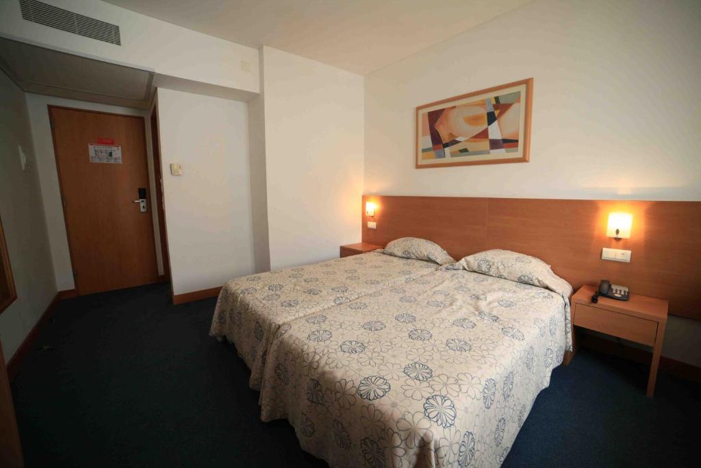 Postel nebo postele na pokoji v ubytování Hotel Matriz