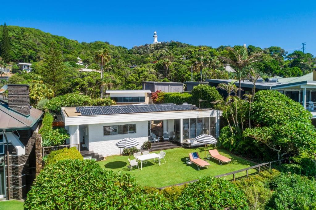 an aerial view of a house with solar panels on the roof at Baywatch at Wategos in Byron Bay