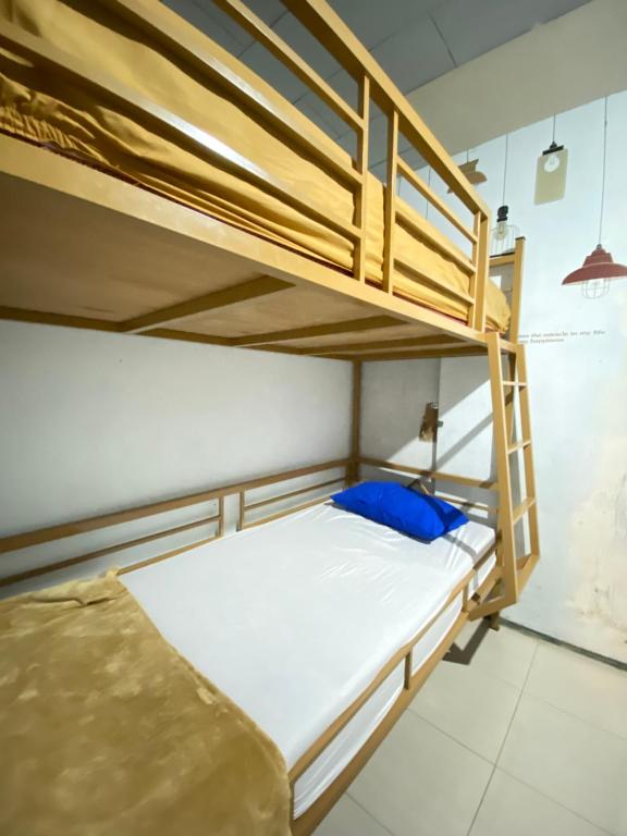 Postel nebo postele na pokoji v ubytování Neo Robiu & Ijen Tour