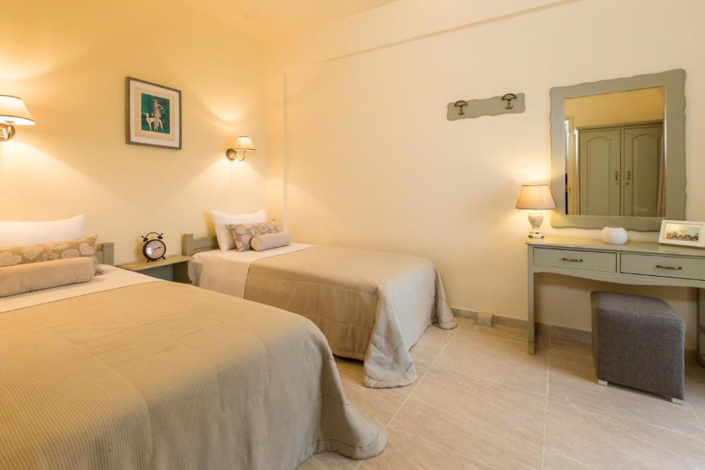Postel nebo postele na pokoji v ubytování Agrimia Holiday Apartments