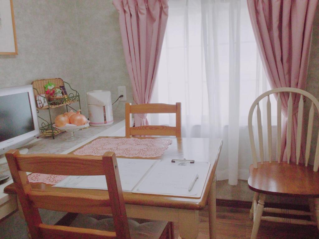 TV a/nebo společenská místnost v ubytování アパートメントホテル Mimoza