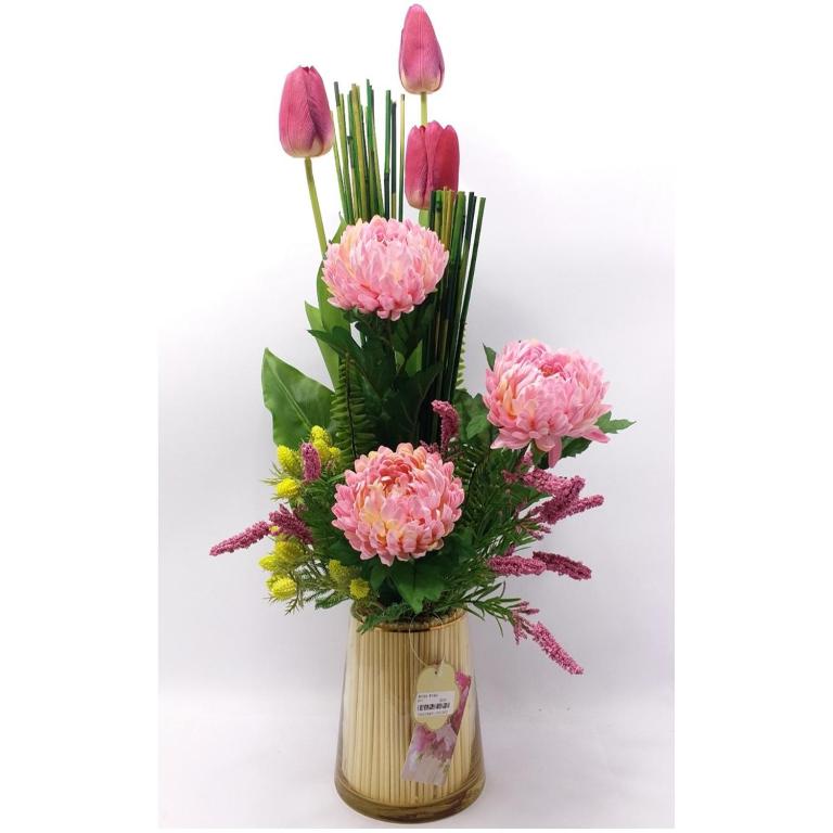 a vase filled with pink flowers on a white background at fair Frankfurt in Frankfurt