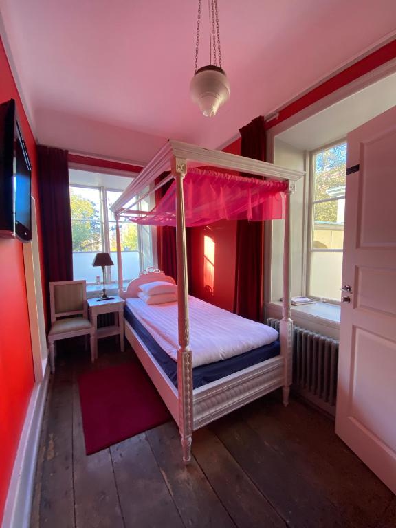 Postel nebo postele na pokoji v ubytování Hotel Hellstens Malmgård