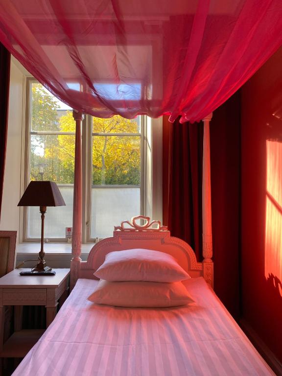 Postel nebo postele na pokoji v ubytování Hotel Hellstens Malmgård