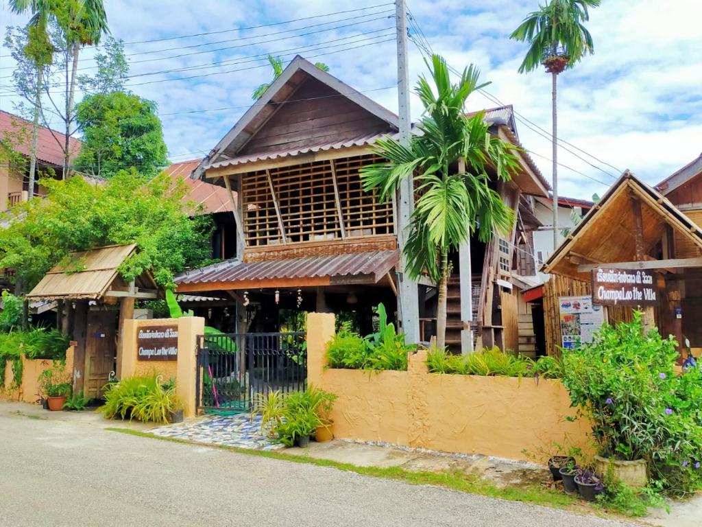 a building on the side of a street at Champalao The Villa in Vang Vieng