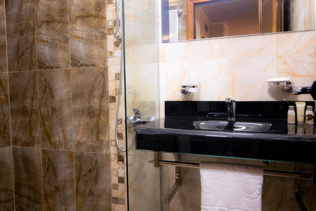 Kuchyň nebo kuchyňský kout v ubytování Hotel Leda