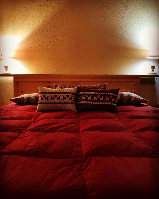 Postel nebo postele na pokoji v ubytování Agriturismo Ciambun