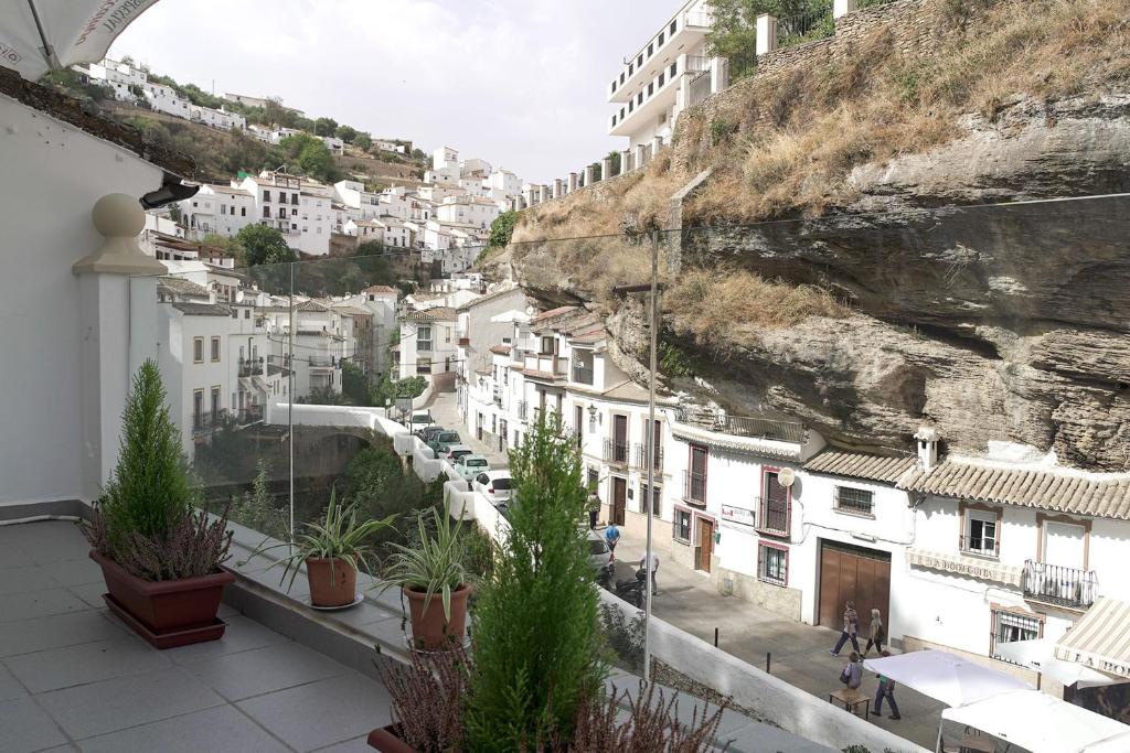 a view from the balcony of a building at Casa Rural Las Cuevas de Setenil in Setenil